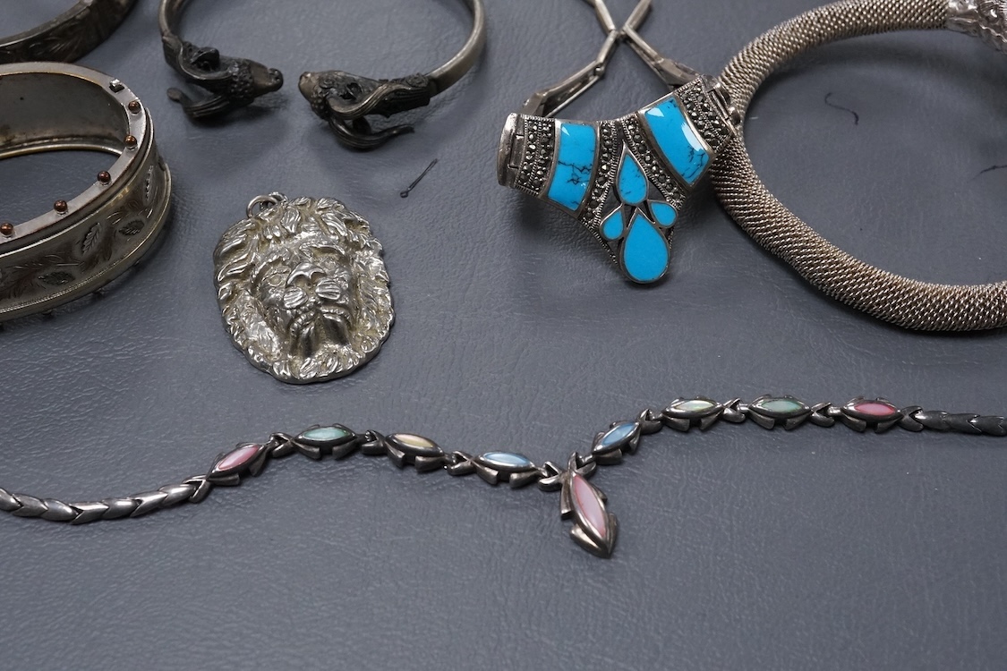 A group of assorted jewellery, including silver and white metal hinged bangles, a 1960's silver mounted cigar cutter by Ramsden & Roed, 925 necklaces and bracelet, etc.